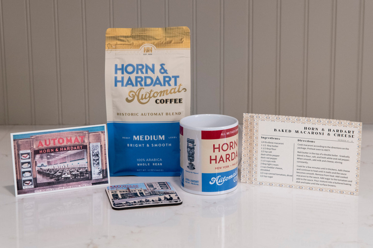 Collection of Horn & Hardart Automat branded items including a mug, packaging, and menu on a white surface.
