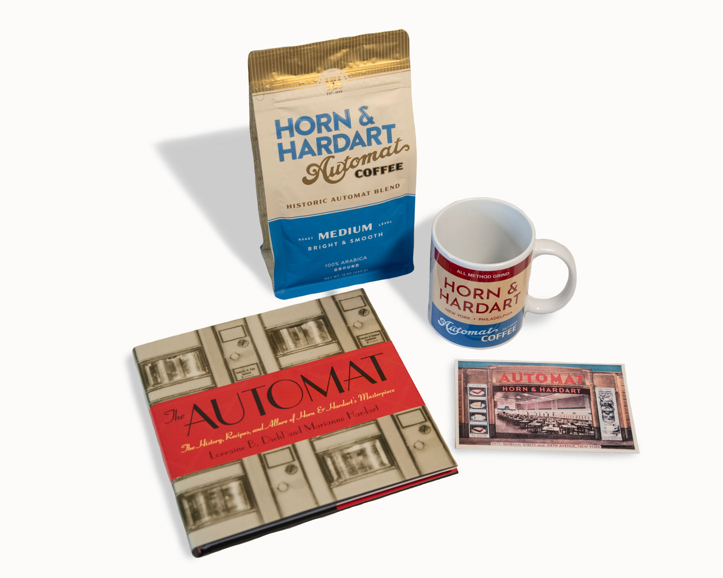 Horn & Hardart coffee package, mug, book, and coasters on a white background