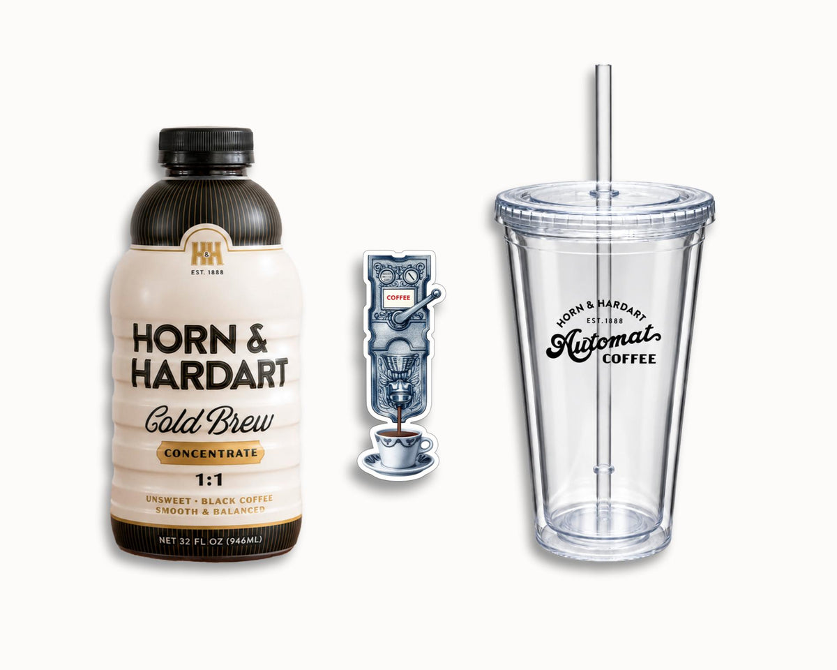 H&H Cold brew with a refrigerator magnet and a tumbler.