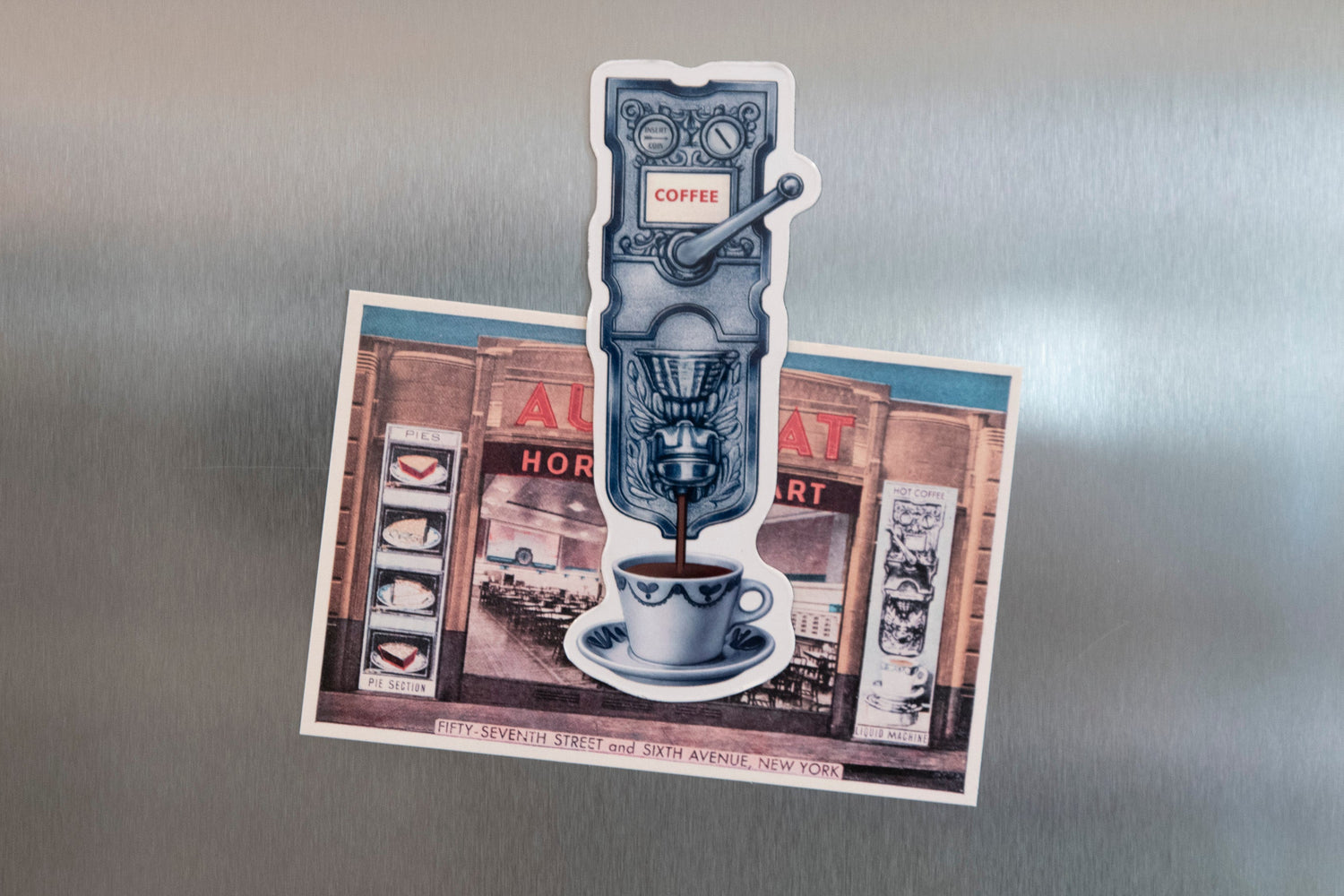 Fridge magnet with coffee-themed design on a metallic surface