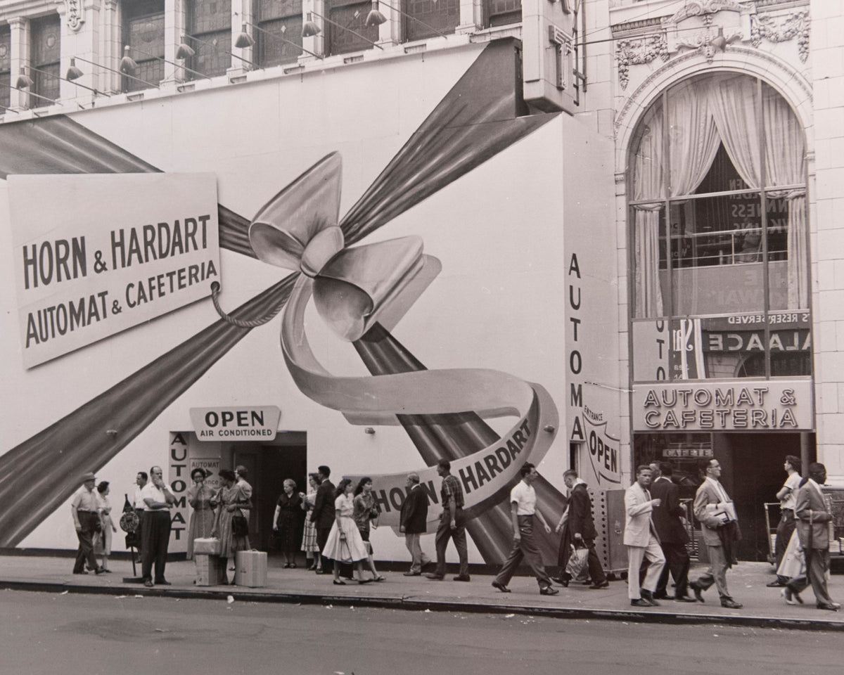 Horn & Hardart vintage photo of the AUtomat Under construction with a large bow covering the front.