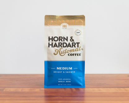 Horn & Hardart Medium Roast Automat Coffee bag sitting on a wooden surface